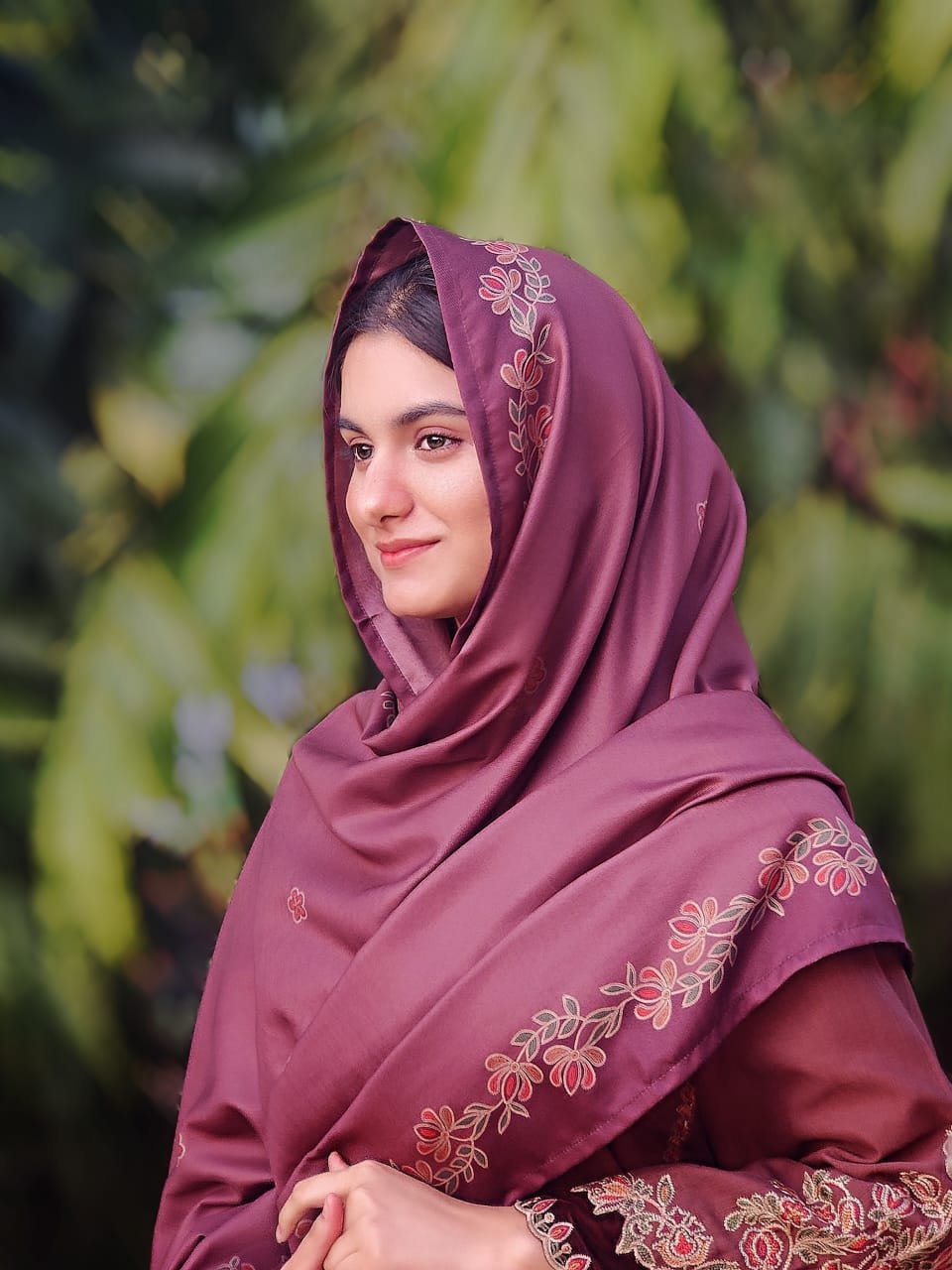 Harmain Fatima wearing a deep plum embroidered ensemble